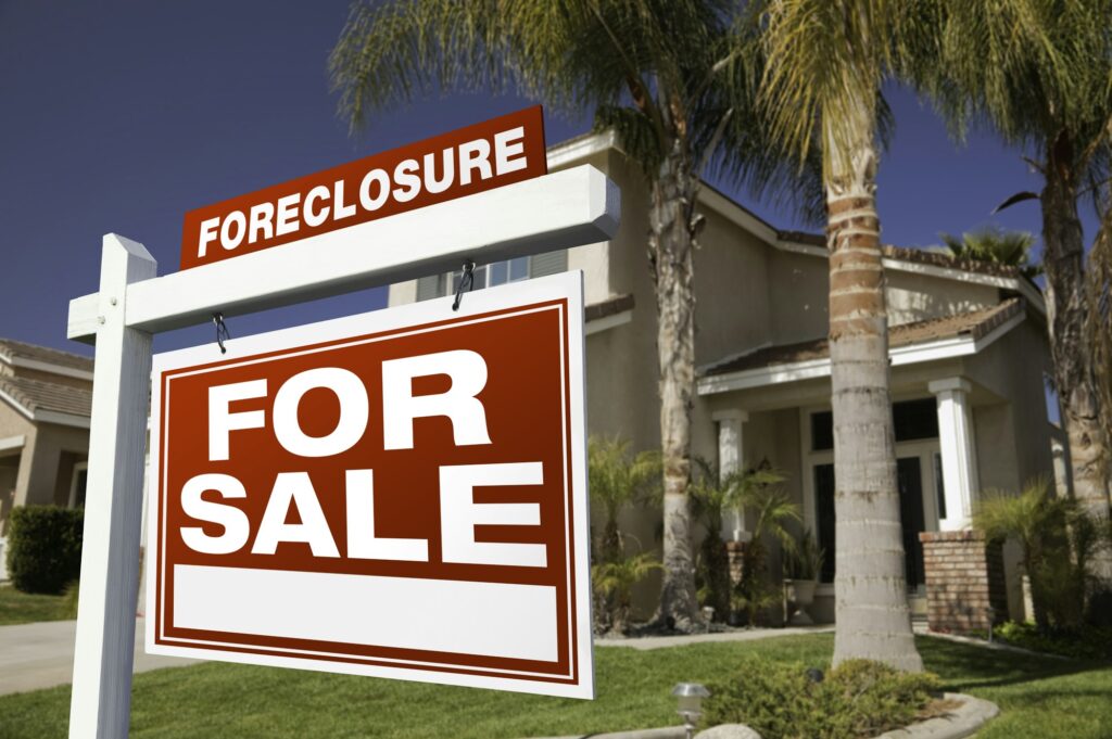 Foreclosure For Sale Real Estate Sign and House