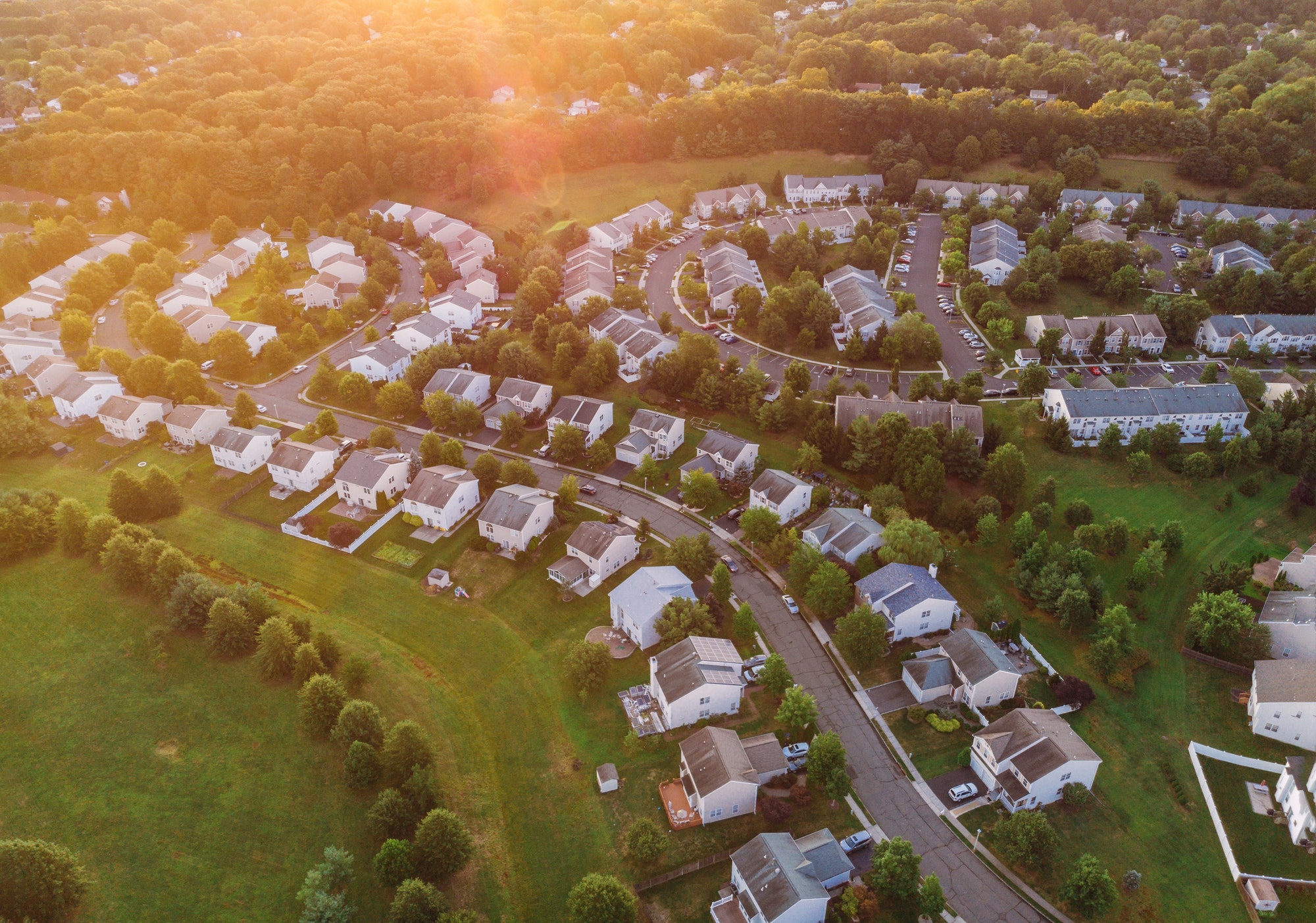 View of the residential area over the roofs of homes a residential suburban district early sunrise